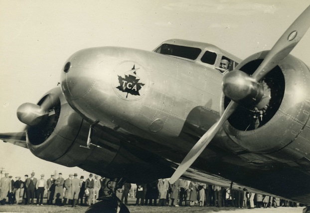 Trans-Canada Airline aircraft with a crowd in the background